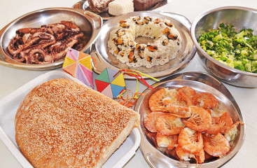 Clean Monday food - lagana bread - seafood - greek halvah and decorative kites