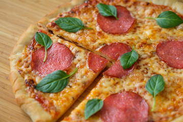 pizza with pepperoni and basil