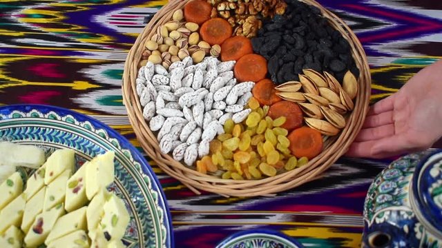 The woman puts on the table oriental sweets