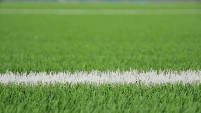 White line of the soccer field. Close-up horizontal slider shot