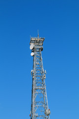 Telecommunication tower and sky blue .