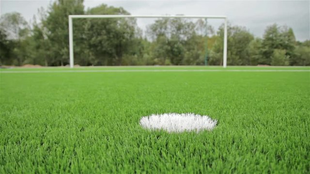 Soccer penalty point on the background of the gate. Close-up, slider shot