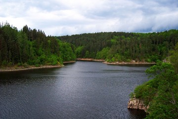Cloudy weather and lake and forest scene view photo