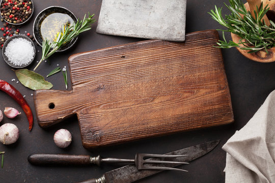 Cooking table with herbs, spices and utensils