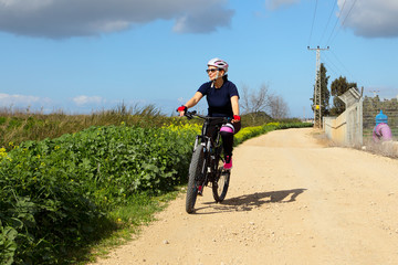 Middle Aged Woman Riding Her Mountain Bike
