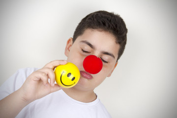 Child With Clown Nose and Smile Ball 