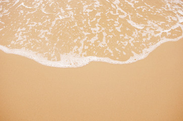 Fototapeta na wymiar Soft wave lapped the sandy beach, Background.