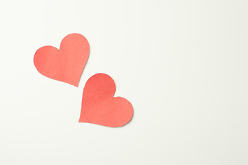 Red paper broken heart on white background