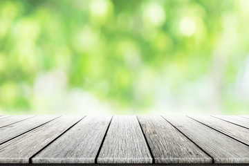 Empty wooden table with blurred city park on background. concept party, products, spring.