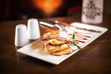 Fluffy Wholemeal Pancakes with sauce on a White Plate. Stille life