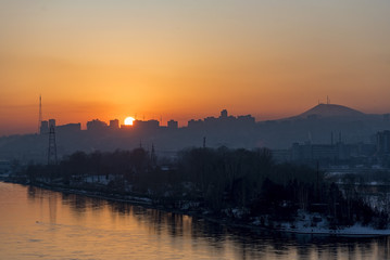 Naklejka premium An amazing sunset over Yenisei river and Krasnoyarsk city in Siberia