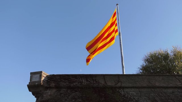 Spanish Flag Hanging Out Of Castillo de Montjuic Barcelona
