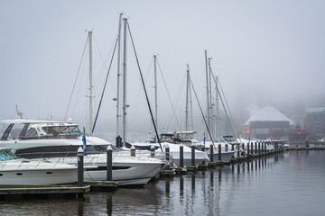 A marina in fog, at the Inner Harbor, in Baltimore, Maryland.