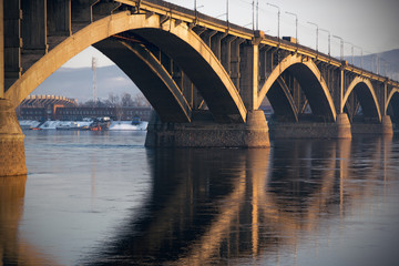 Obraz premium Bridge Communal over the Yenisei river in Krasnoyarsk in spring evening