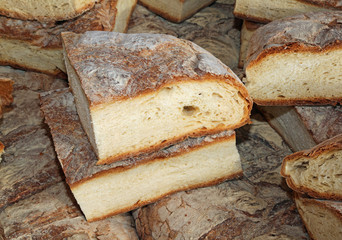 bread cooked in a wood oven for sale in market stall