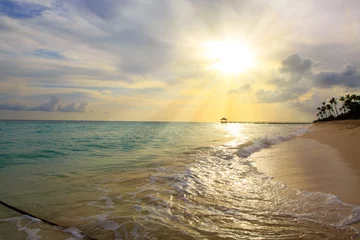 Cercles muraux Jetée Sunset on the beach of caribbean sea.