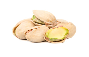 Several salted pistachio nuts with a half on a white background