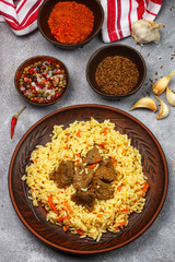 Pilaf with meat and vegetables with seasonings and spices. A popular dish of Asian cuisine