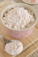 Custard powder a cornflour based powder which when mixed with hot milk produces an egg free custard sauce