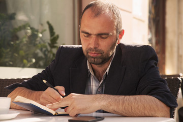 businessman planning his workday. Time management concept. (Freedom, freelance, success, money)