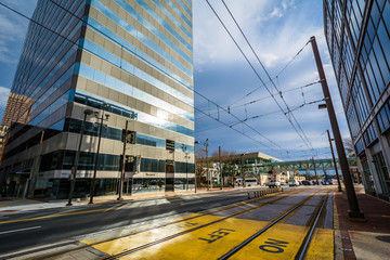 Light Rail tracks and modern buildings along Howard Street, in downtown Baltimore, Maryland.