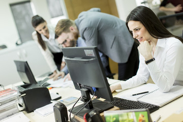 People working in a busy office