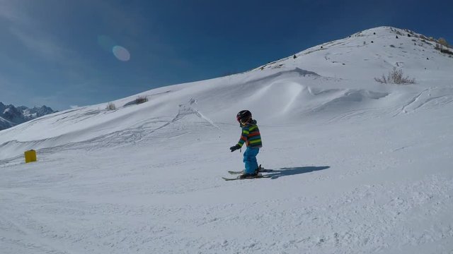 Little boy skiing.
Little boy enjoying skiing. Child learning to ski.
