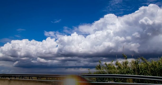 Time-lapse of clouds near the highway in Italy, Tuscany. 4K