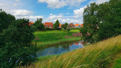 Fototapeta na wymiar Colorful houses at the river in old city Fredericia, Denmark