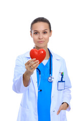 Positive female doctor standing with stethoscope and red heart symbol