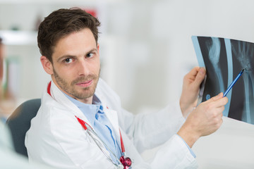 doctor holding x-ray film