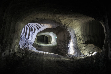 Chalk mine tunnel with traces of drilling machine