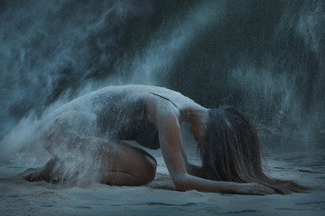 Performance - a woman lying in the flour, around the dust.