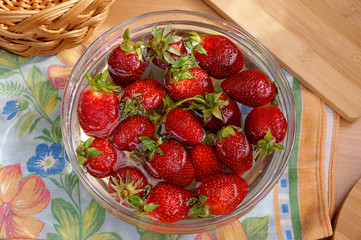 Fresh strawberry in capacity with water
