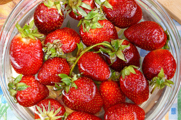 Fresh strawberry in capacity with water