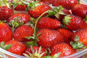 Fresh strawberry in capacity with water