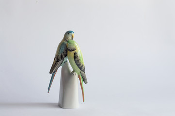 Colorful parrots porcelain figurines