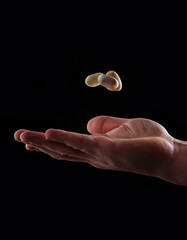 Hand with floating pebble stack finding inner peace concept gravity