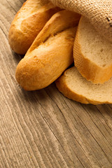 French baguette sliced on the wooden desk
