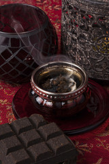 Obraz na płótnie Canvas In most Arab countries incense is burned in the form blocks or scented chips called bukhoor or bakhoor