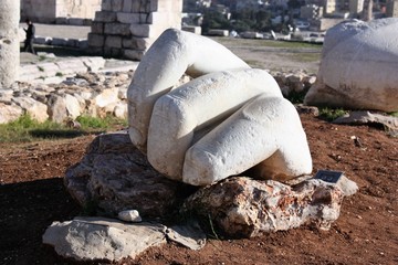 Hand in front of Hercules temple at Citadel Hill in Amman in Jordan, Middle East