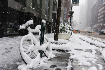 Naklejka na ściany i meble Bicycle covered in snow during winter storm Niko (Manhattan, New York City)