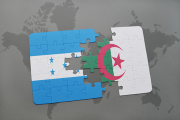 puzzle with the national flag of honduras and algeria on a world map