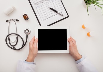 Dctor work on digital tablet.