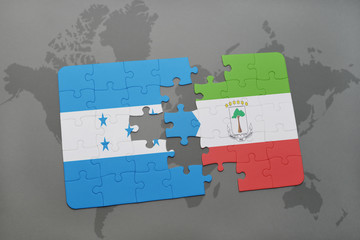 puzzle with the national flag of honduras and equatorial guinea on a world map