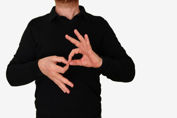Sign language interpreter man translating a meeting to ASL, American Sign Language. Empty copy...