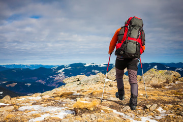 The man climbed to the top of the mountain.