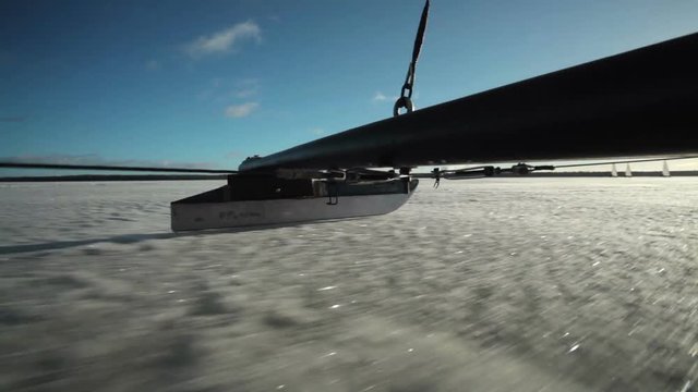 The skate of iceboat rides on the ice.
