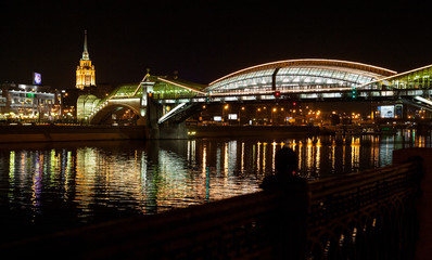 Obraz premium The reflection of the bridge in the Moscow river, Russia.