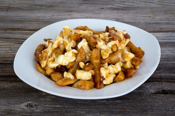 Poutine quebec meal with french fries, gravy and cheese curds